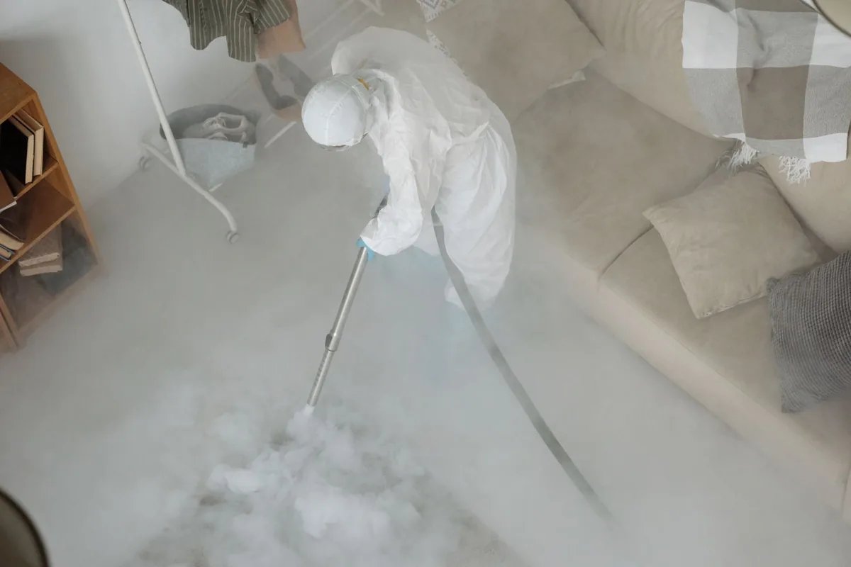 Biohazard cleanup technician in protective equipment, Lake Fenton, MI